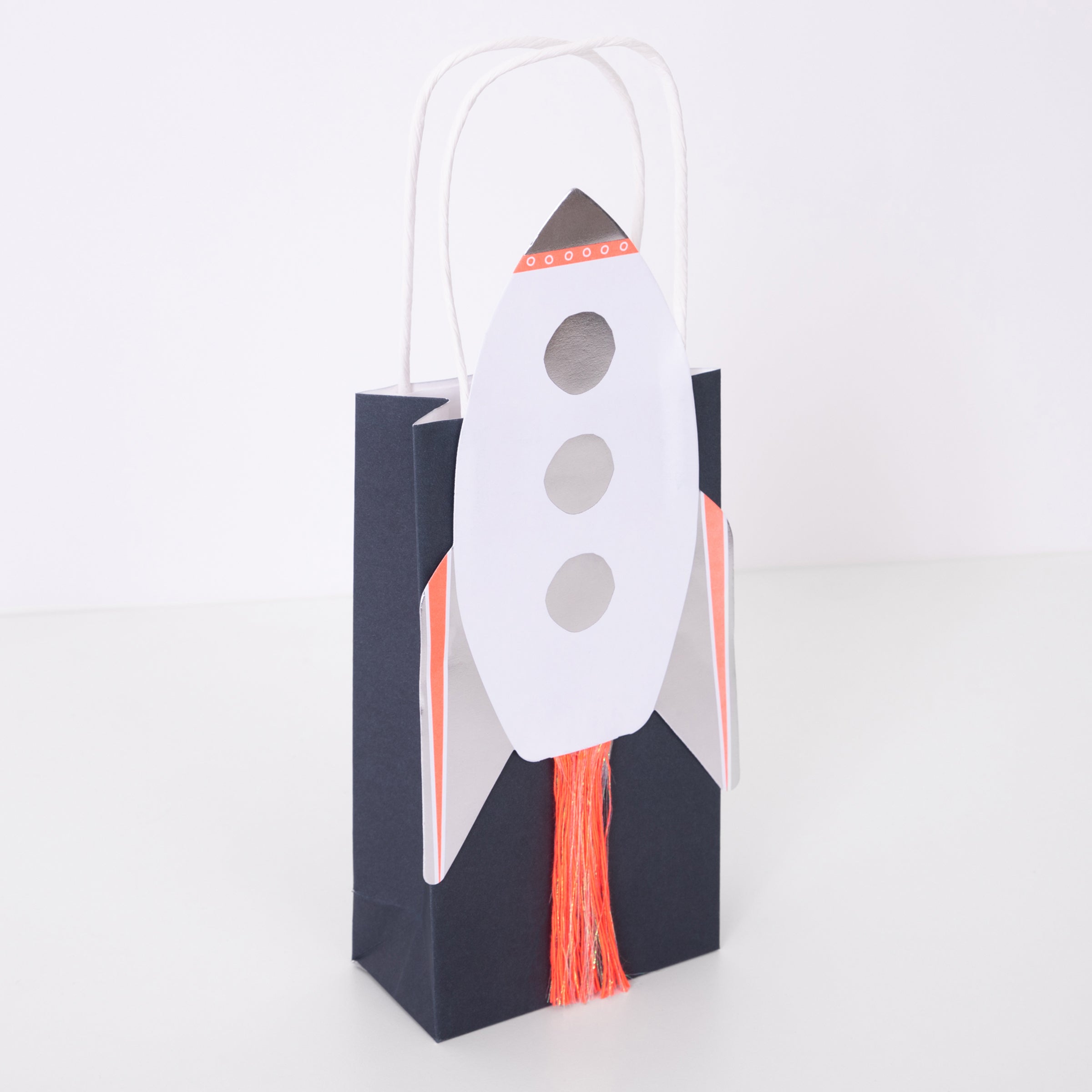 Our paper party bags are decorated with a shiny rocket, perfect as small gift bags too.