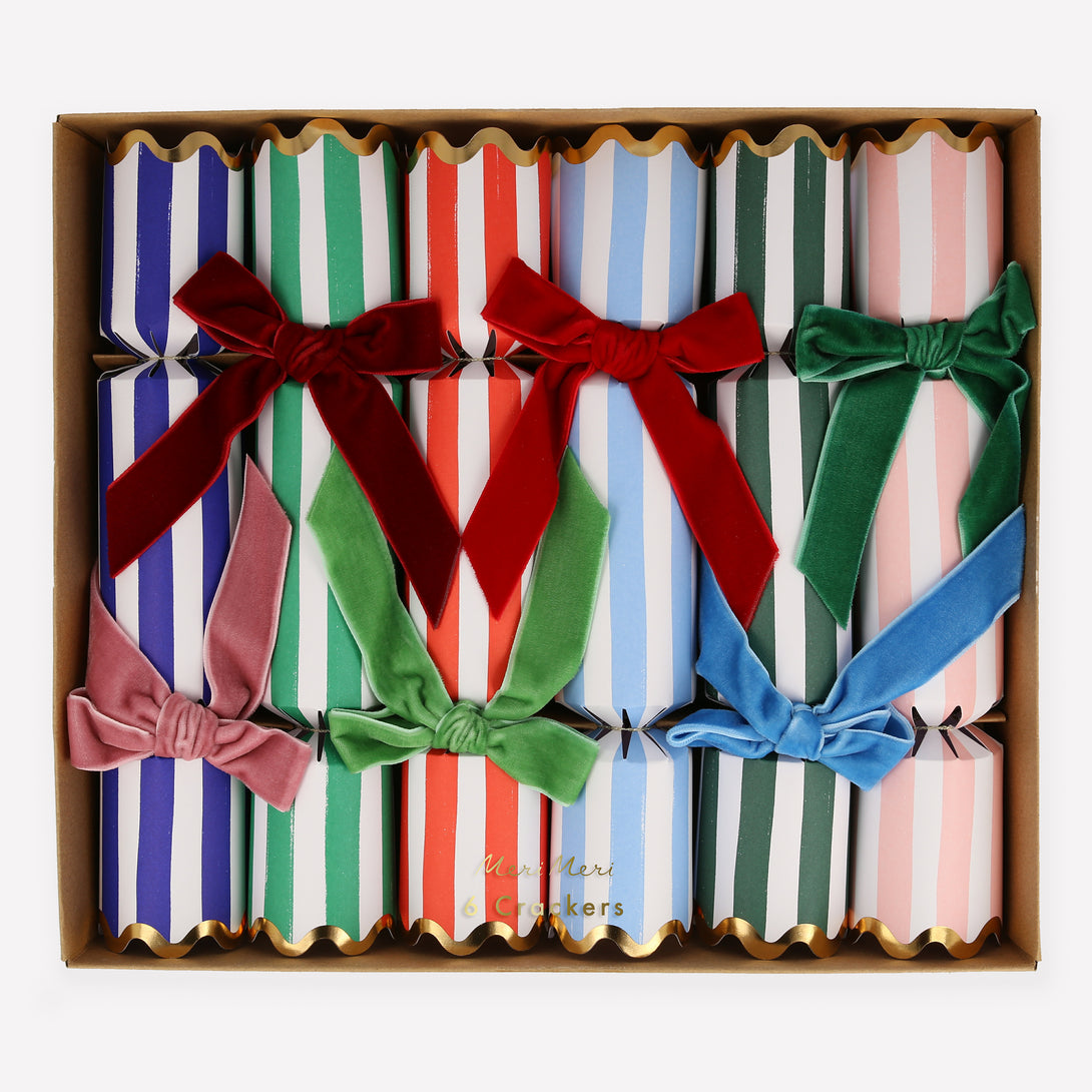 Our luxury crackers, with stripes and bows, contain fun erasers, paper party hats and more.