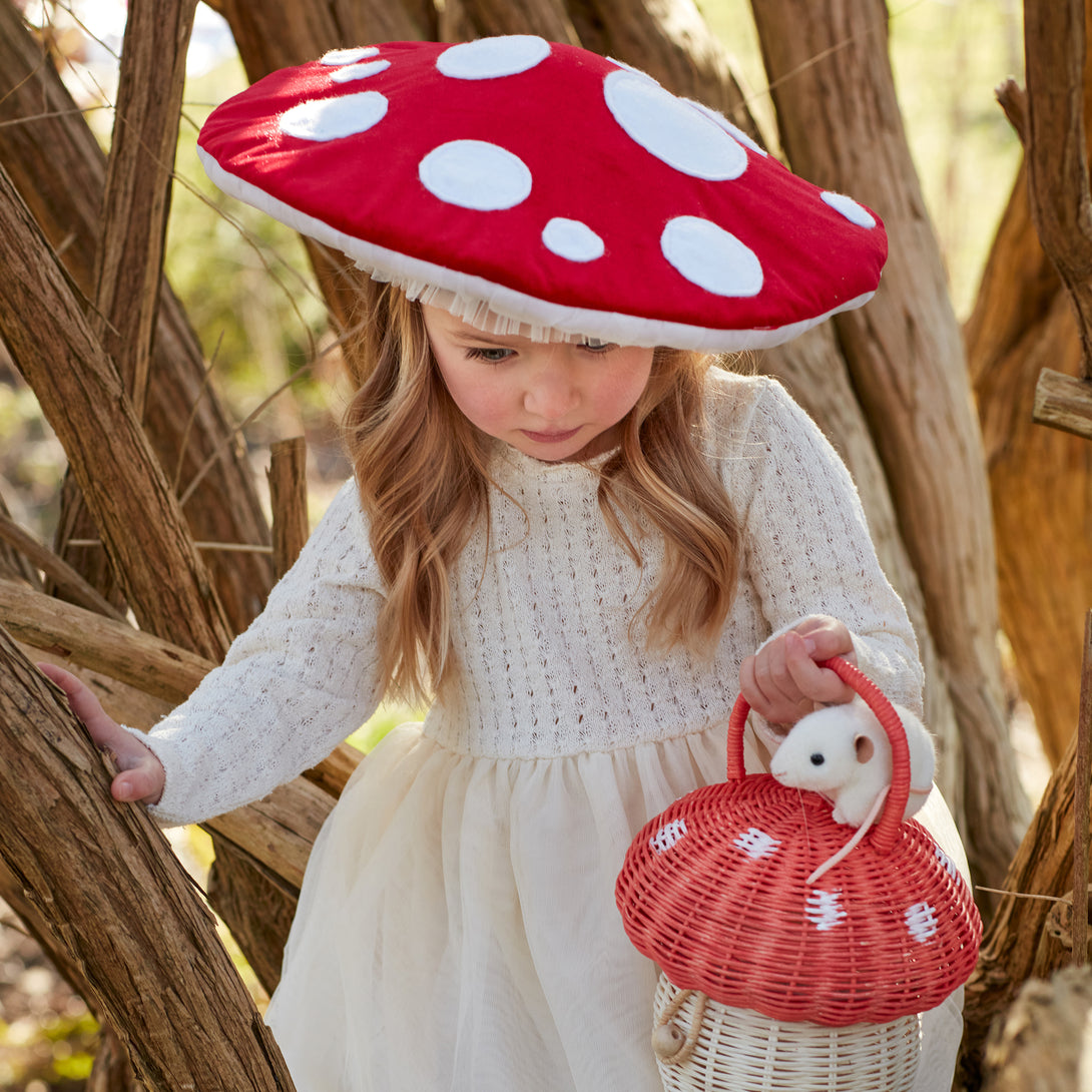 This adorable mushroom hat is crafted from soft velvet, perfect to add to your Halloween party supplies or for a fairy party.