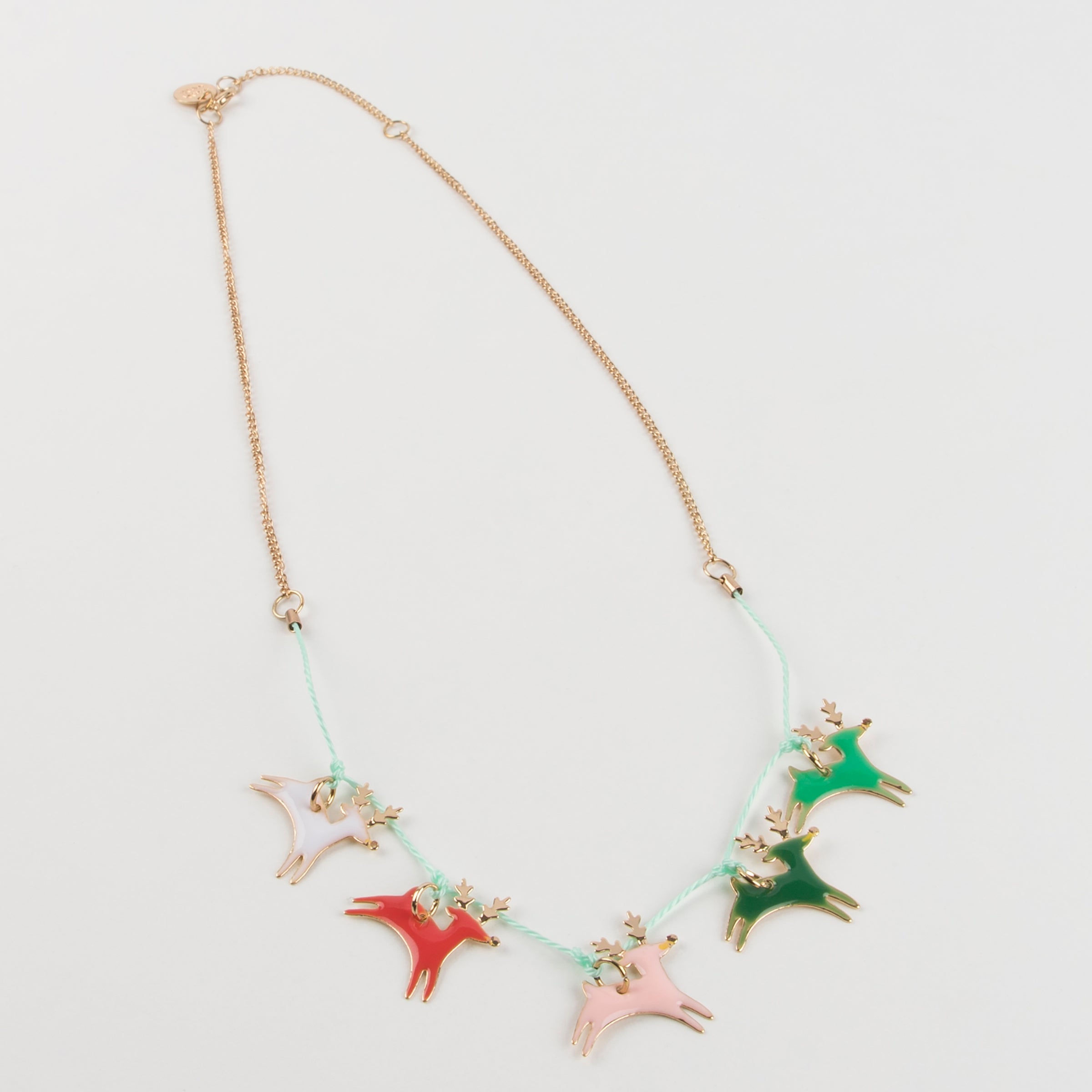 This Christmas necklace, crafted with enamel reindeers, is a wonderful kids stocking filler.