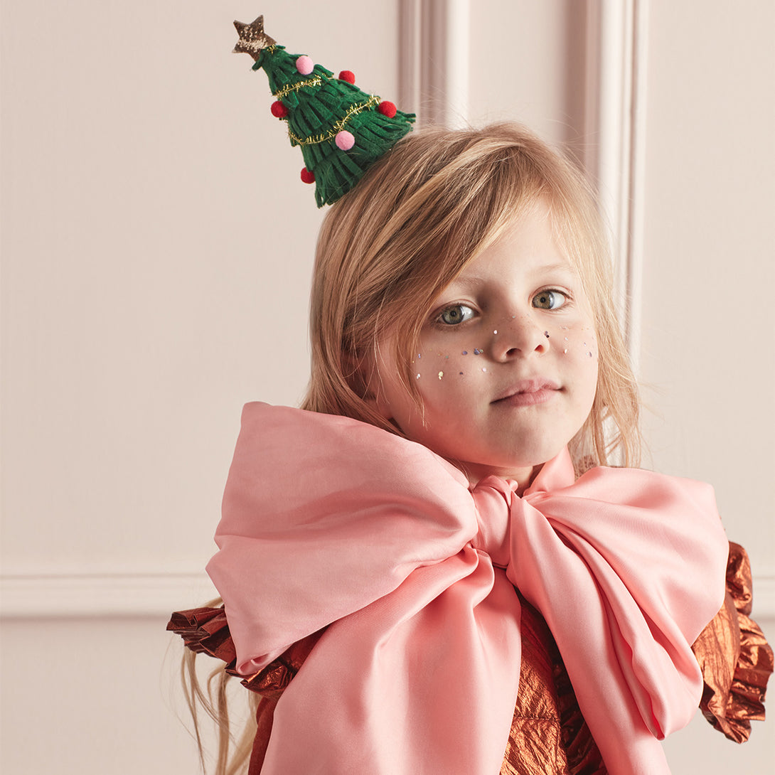 Our Christmas hair accessory is crafted from felt to look like a sparkling Christmas tree.