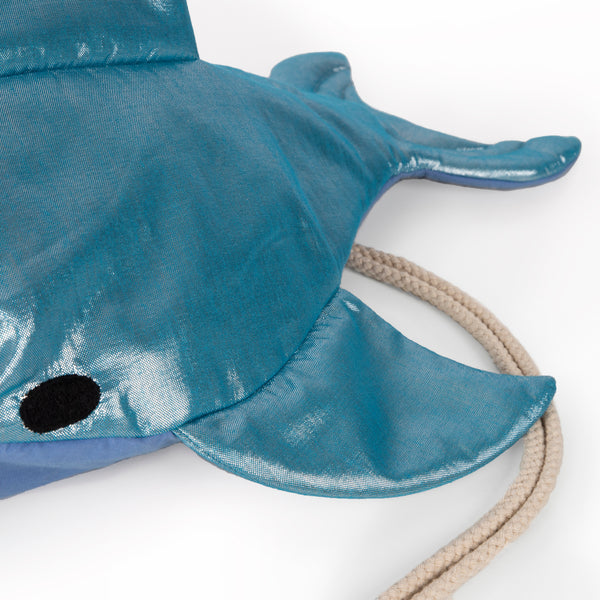 This shiny shark is  a backpack crafted from blue lamé fabric with a cotton lining and cord straps. Image4