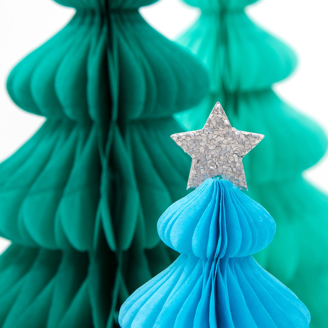 These beautiful honeycomb decorations are made from tissue paper with shining silver stars on top.