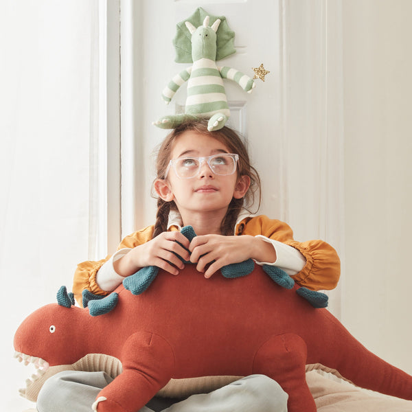 This Triceratops kids soft toy is an organic cotton toy with striped details. Image2